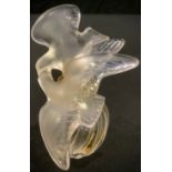 A Lalique, France, Nina Ricci scent bottle, the stopper modelled as a pair of doves, 10cm high,