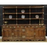 An Indo-Portuguese hardwood dresser, moulded cornice above a deep frieze carved with mirrored S-