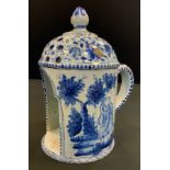 A 19th century Dutch delft lantern, painted in tones of blue with figures in a landscape, 21cm high