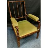 A 19th century rosewood bobbin turned side chair, stuffed over seat and arm rests, c.1840