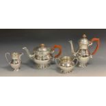 A mid 20th century silver four piece tea set, teapot, hot water jug, sugar bowl and milk jug,