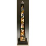 A pietra dura library obelisk, inlaid in the manner of Ashford marble with malachite, lapis