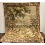 A 20th century machine woven tapestry, with deers, pheasants fruit, flowers and foliage, the