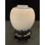 A Chinese ovoid ginger jar, rice grain reticulated, underglaze blue cell and lappet borders, 17cm