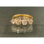A four stone diamond ring, linear set with four old cut diamonds, total estimated diamond weight