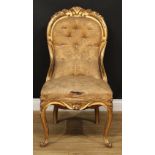 A 19th century giltwood and gesso chair, stuffed-over upholstery, carved and applied throughout with