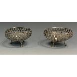 A pair of silver baskets, pierced sides, claw feet, 9.5cm diam, Fenton, Russell & Co Ltd, Birmingham