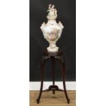 A George II Revival mahogany tripod statuary pedestal, circular plateau, cabriole legs carved to the