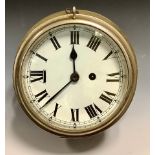 An early 20th century Marine brass wall clock, Roman numerals, single winding hole, 25cm diam