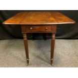 A 19th century mahogany Pembroke table, rounded rectangular top, small drawers to frieze, tapered