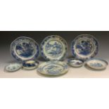 A Chinese shaped octagonal plate, decorated in underglaze blue with willow trees, sampan and