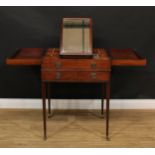 A George III mahogany enclosed dressing table, hinged bifold top enclosing a mirror, angle-