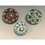 An English domed paperweight, set with coloured canes, 9cm diam; others (3)