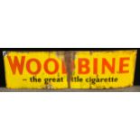 An enamelled rectangular sign, Woodbine - the great little cigarette, 43cm x 150cm