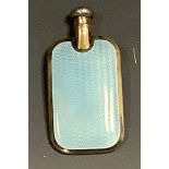 An early 20th century silver and blue guilloche enamel rounded rectangular scent bottle, domed