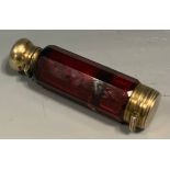 A Victorian ruby glass doubled ended scent/vinaigrette, domed hinged cover, 9cm high, c.1870