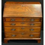 A George III mahogany bureau, c.1800 fall front with fitted interior, above four long drawers,