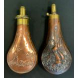 A 19th century copper shot flask, embossed with hanging game, the brass spout with sprung mechanism,