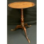 A George III mahogany circular occasional table, c.1760 dished top, cannon barrel column, tripod