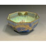 A Wedgwood lustre octagonal bowl, the exterior with gilt dragons on a mottled blue ground, the