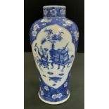 A Chinese baluster vase, painted in tones of underglaze blue with auspicious precious objects,