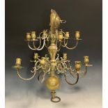 A 20th twelve light two tier brass ceiling chandelier, candle sconces, scroll arms, 66cm high