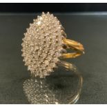 A diamond navette cluster ring, pave set with round brilliant cut diamonds, total diamond weight 2.