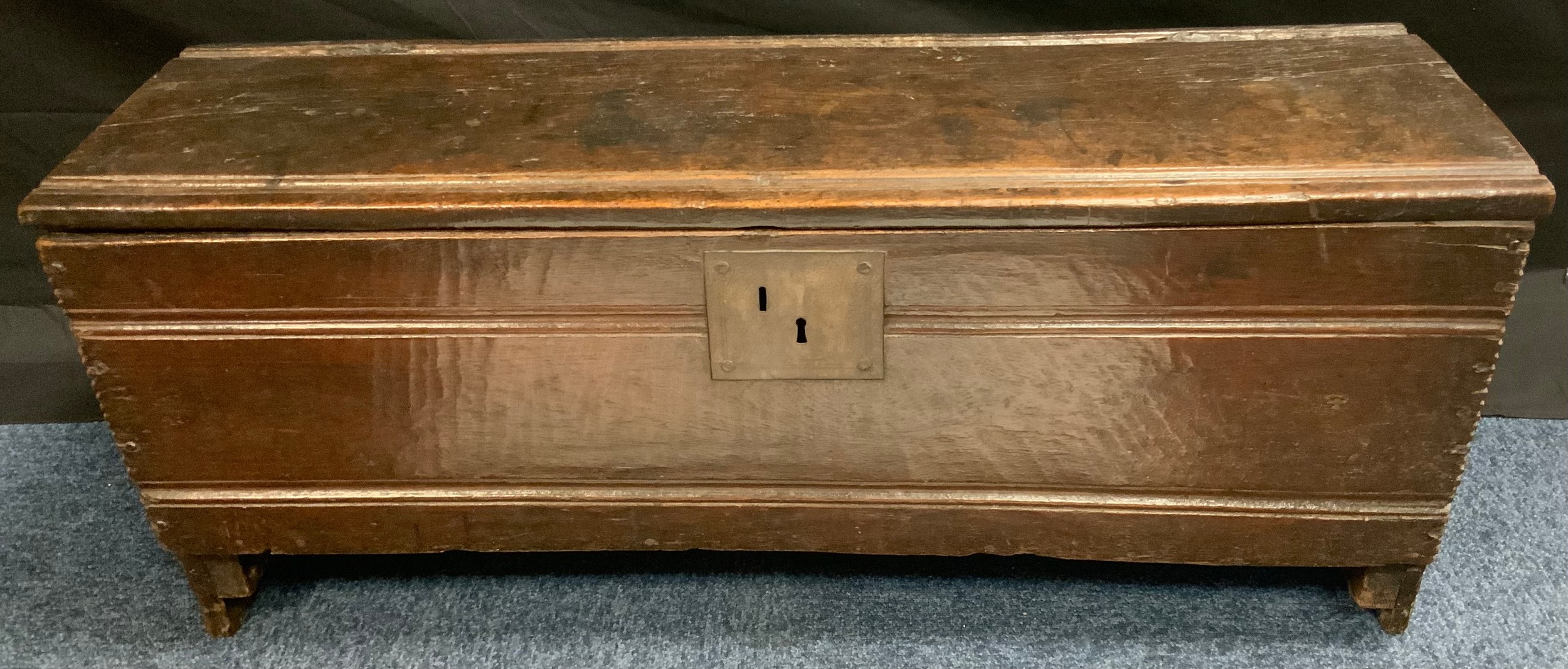 An 18th century oak six plank sword box, c.1750 notched borders, shaped ends, 447cm high 106cm