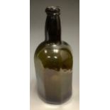 An 18th century olive glass octagonal wine bottle, c.1780 kick-up base, 25.5cm high