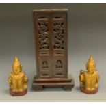 A Chinese family shrine cabinet, pierced doors, scroll feet, the boards for the relatives of Sz-To-