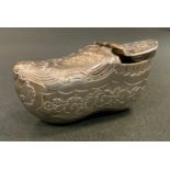 A silver coloured metal novelty snuff box, as a clog probably Dutch, engraved with foliate