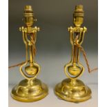 A pair of brass Pullman carriage gimbal lamp, fitted for electricity, 31cm high, late 19th century