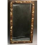 A Japanese rectangular shibiyama wall mirror, bevelled plate, the frame inlaid in mother-of-pearl,