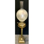 An early 20th century brass and copper oil lamp, fluted column, stepped square base, frosted