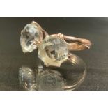 A very pale blue eight point star cut two stone dress ring, possibly topaz, white metal shank,