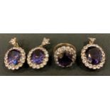 A synthetic corundum and white sapphire effect pendant, earrings and dress ring suite, each with