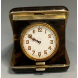 An early 20th century silver and faux tortoiseshell travelling folding clock, Arabic numerals, 8.5cm