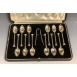 A set of twelve silver coffee spoons, seal tops, bows ensuite, Josiah Williams & Co (David