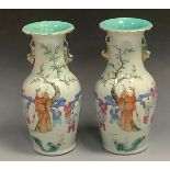 A pair Chinese ovoid vases, decorated in polychrome with figures, dragon handles to sides, turquoise