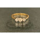 A diamond ring, linear set with three old brilliant cut diamonds, total estimated diamond weight