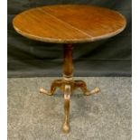 A George III oak circular occasional table, c.1760 cabriole legs, pad feet 71cm high 65cm diam