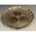 A silver shaped circular tray, in the George III style, knurl feet, 26cm diam, James Dixon and Sons,