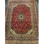 A Kashan woollen carpet, signed, approx 350cm x 250cm