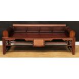 A Chinese hongmu daybed, four panel back, slatted revolving headrests or arms, panel seat, shaped