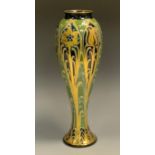A Mcintyre Florian Ware slender ovoid vase, tube lined with tulips and flowers in gilt, with sinuous