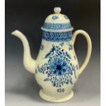 An English Pottery baluster coffee pot and cover, decorated in underglaze blue with stylised