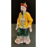 A Chinese Republic Period porcelain figure, of a Court Official, by You Changzi , 39cm high,