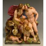 A Continental figure group, with a scantily draped young Bacchus, his companion, cherub, faun and