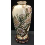 A Japanese Satsuma pottery vase, decorated with flowers, printed marks, signed Kansei, Made under