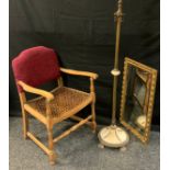 A neoclassical gilt metal and Alabaster standard lamp; rattan arm chair; gilt framed rectangular